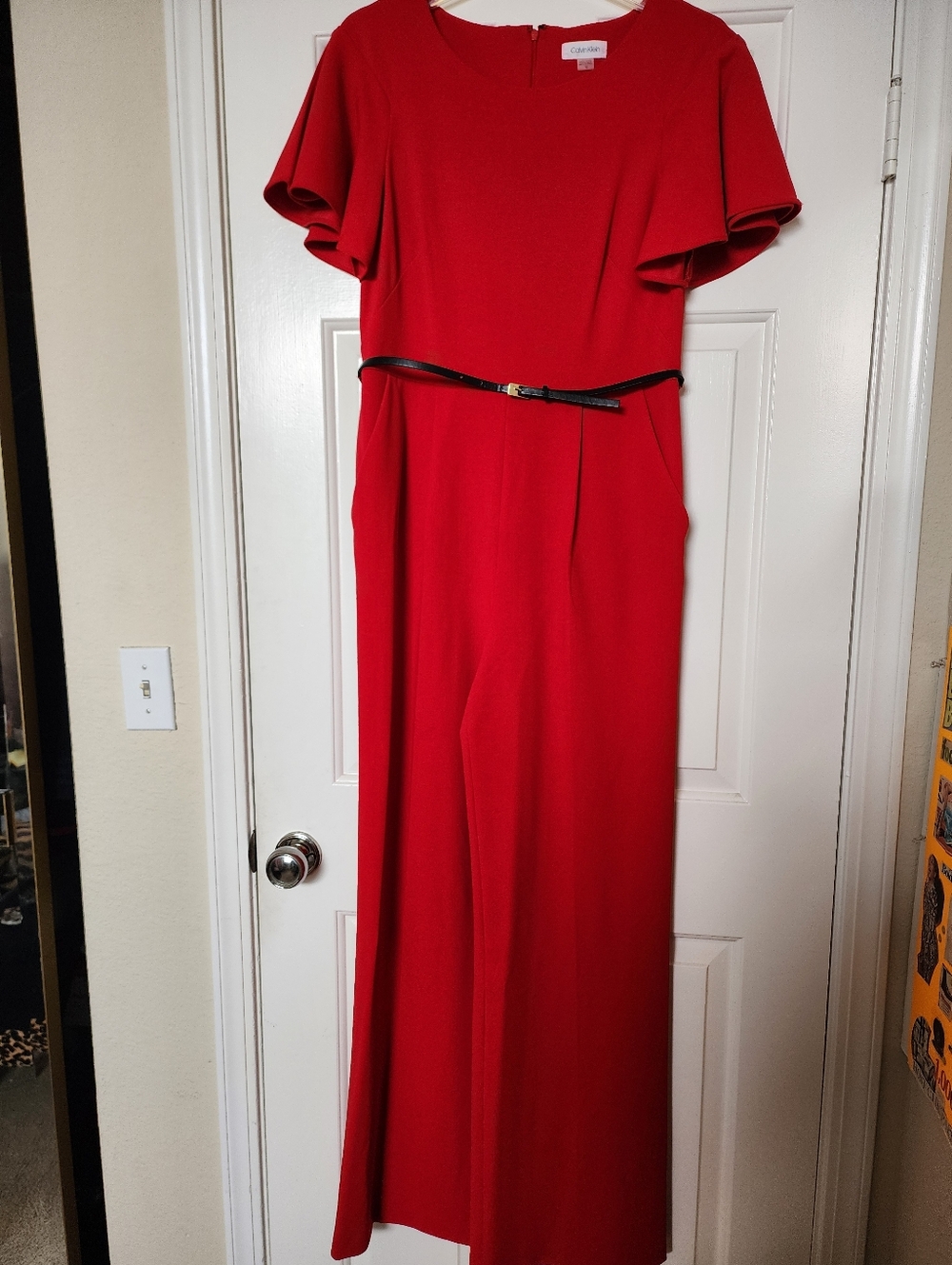 Calvin Klein Red Jumpsuit with Short Flutter Sleeves and Black Belt.